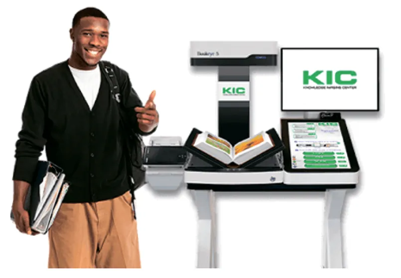 A student beside a KIC BookEye scanning station